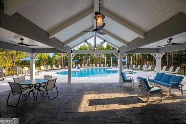 pool with ceiling fan, a gazebo, an outdoor hangout area, and a patio area