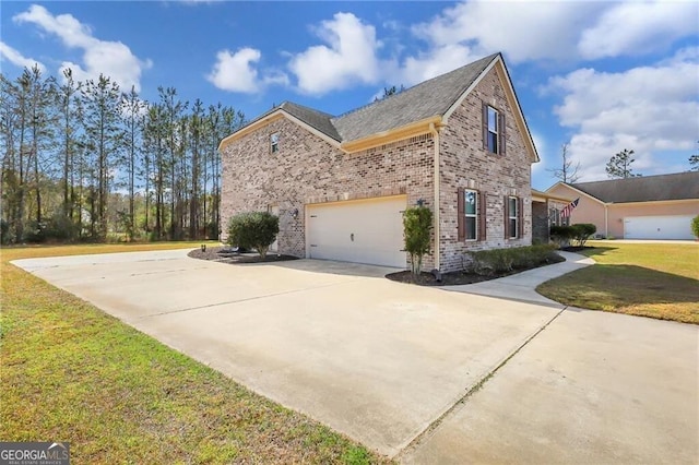 view of home's exterior featuring driveway, a lawn, and brick siding