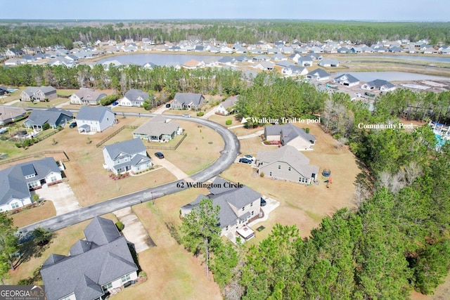 aerial view with a residential view and a water view