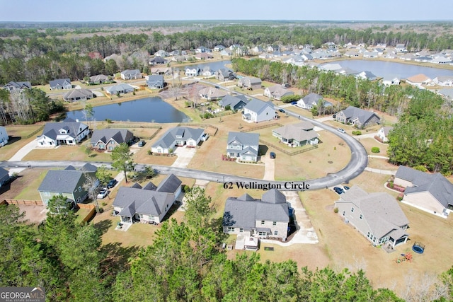 bird's eye view featuring a residential view and a water view