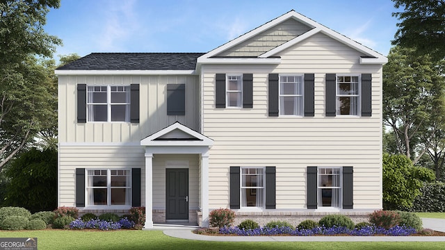 craftsman house featuring brick siding, board and batten siding, and a front yard