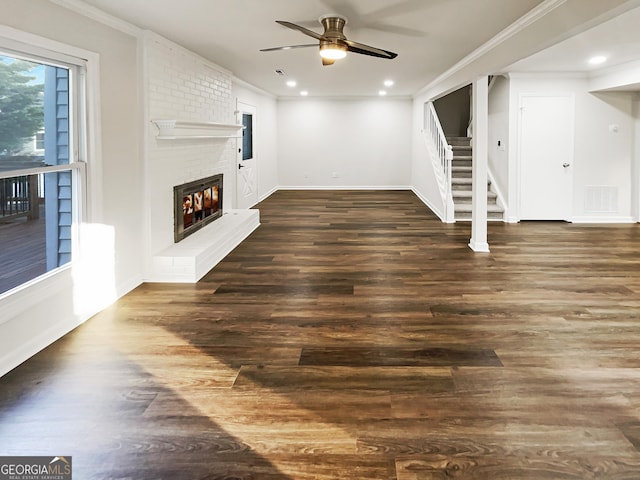 unfurnished living room with stairs, ornamental molding, a fireplace, and visible vents