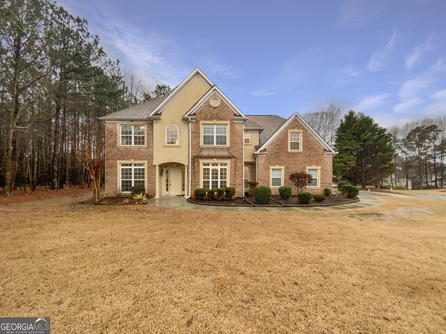 view of front of home featuring brick siding