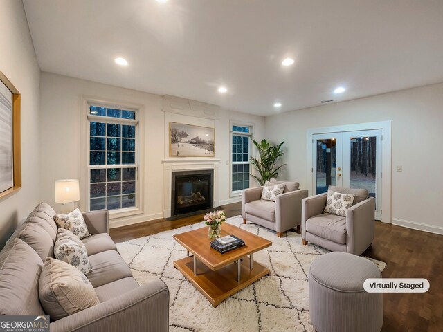 living room featuring recessed lighting, french doors, and wood finished floors