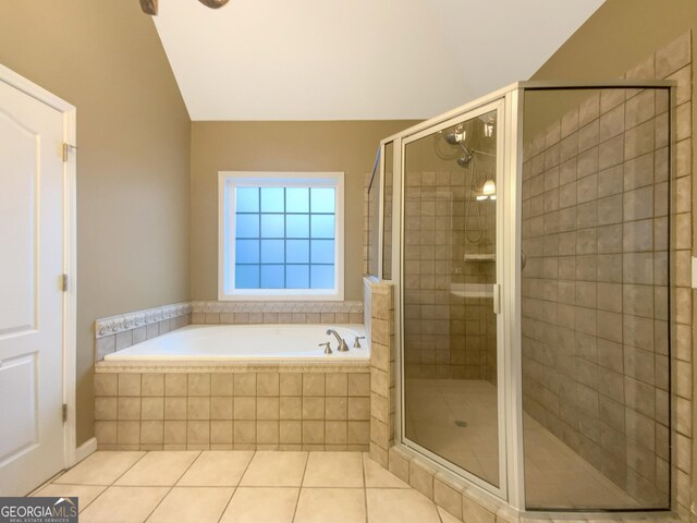 full bathroom with a shower stall, a bath, and tile patterned floors