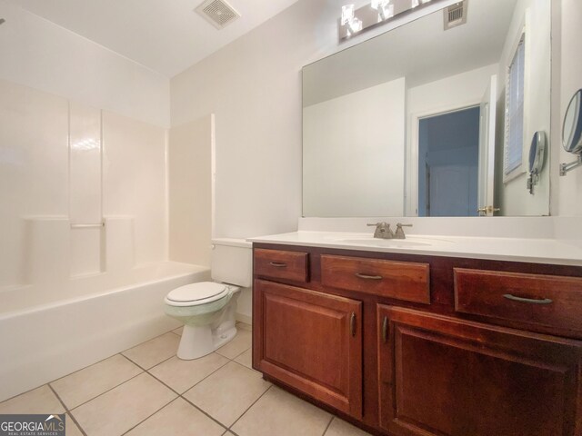 bathroom with toilet, tile patterned flooring, visible vents, and vanity