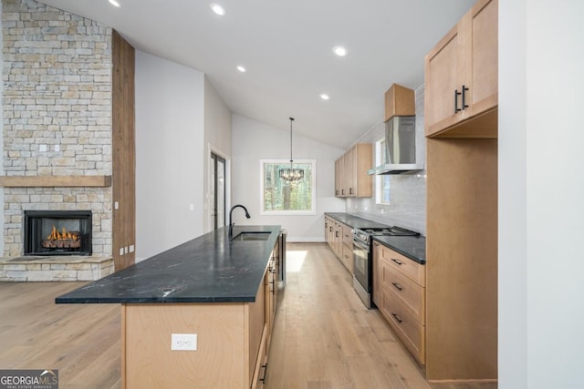 544 Lemmon Ln, Ellijay, GA 30540 - kitchen with lofted ceiling, wall chimney exhaust hood, light wood-style flooring, stainless steel range with electric stovetop, and a sink