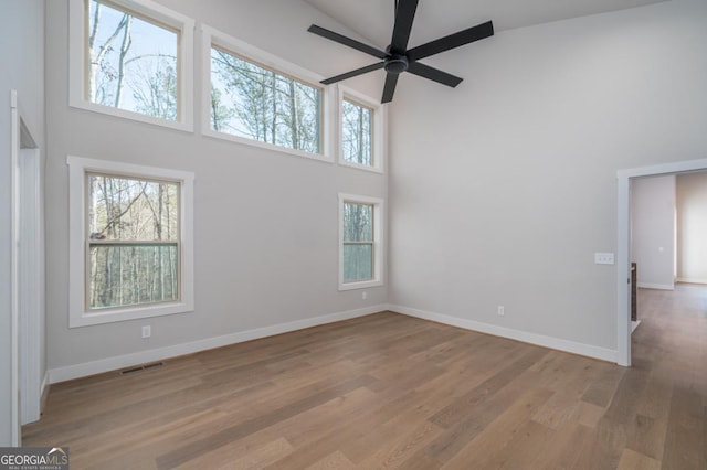 544 Lemmon Ln, Ellijay, GA 30540 - spare room featuring a high ceiling, visible vents, a wealth of natural light, and wood finished floors