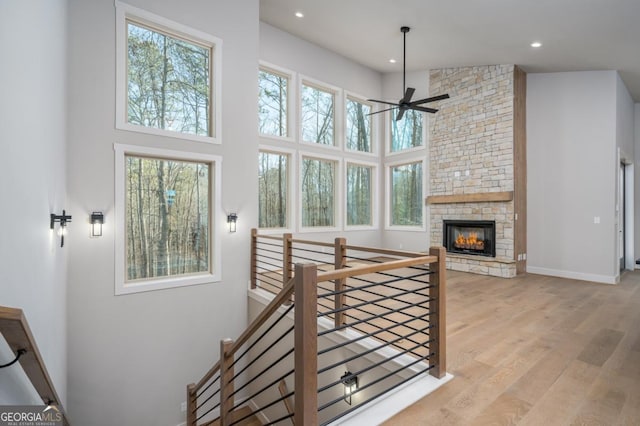 544 Lemmon Ln, Ellijay, GA 30540 - living area featuring baseboards, wood finished floors, a high ceiling, a stone fireplace, and recessed lighting