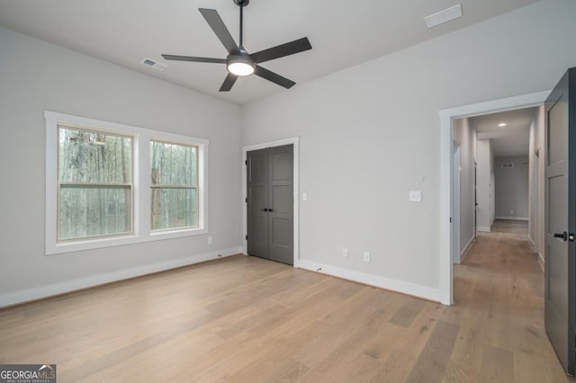 544 Lemmon Ln, Ellijay, GA 30540 - unfurnished bedroom featuring ceiling fan, light wood finished floors, visible vents, and baseboards