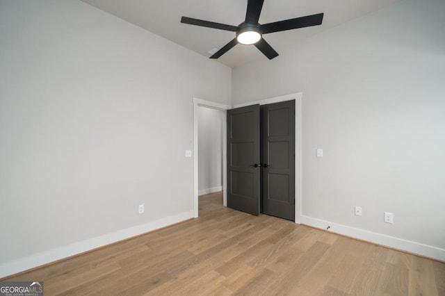 544 Lemmon Ln, Ellijay, GA 30540 - unfurnished bedroom featuring baseboards, ceiling fan, and light wood-style floors