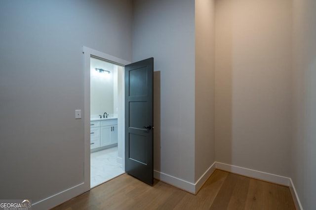 544 Lemmon Ln, Ellijay, GA 30540 - hallway with a sink, light wood-style flooring, and baseboards