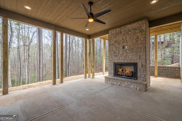 544 Lemmon Ln, Ellijay, GA 30540 - view of patio / terrace with a view of trees, an outdoor stone fireplace, and a ceiling fan