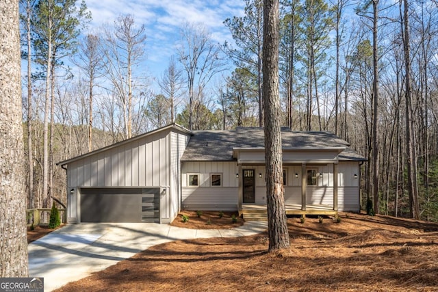 544 Lemmon Ln, Ellijay, GA 30540 - view of front of property featuring a garage, concrete driveway, a shingled roof, and board and batten siding