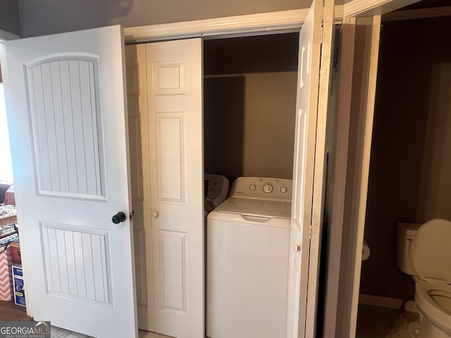 laundry area featuring washer / dryer and laundry area