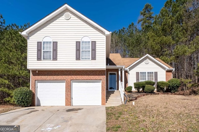 view of front of home with a garage, concrete driveway, and brick siding