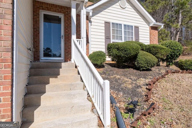 entrance to property with brick siding