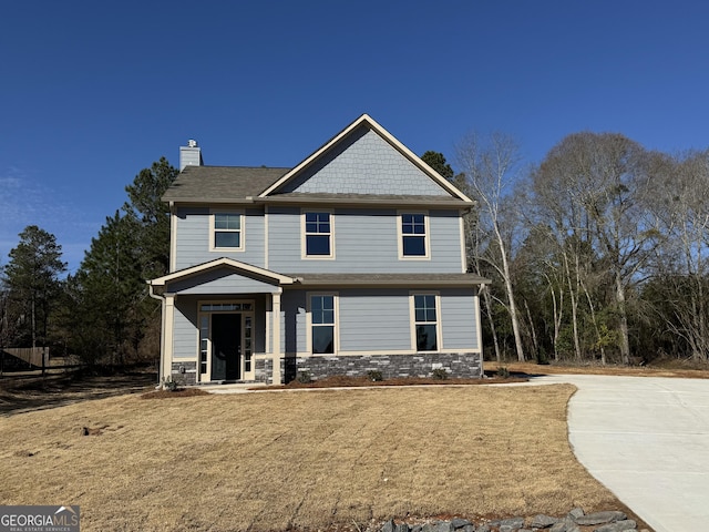 craftsman-style home featuring a chimney