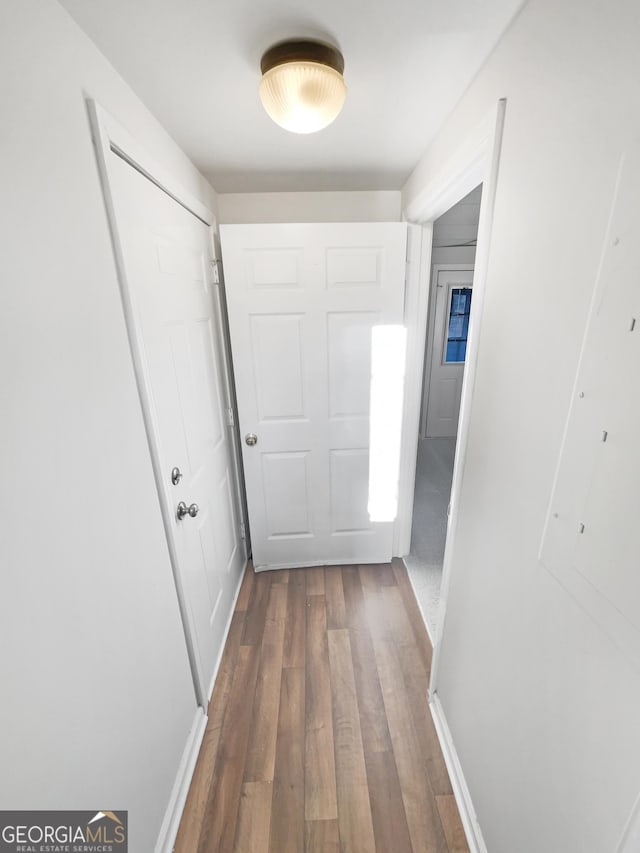 corridor with wood finished floors