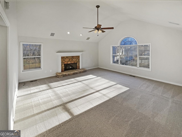 unfurnished living room featuring lofted ceiling, carpet, a fireplace, and baseboards