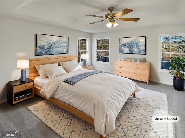 bedroom featuring ceiling fan and baseboards