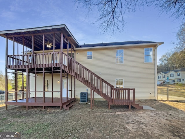 rear view of house with central air condition unit, stairway, ceiling fan, fence, and a wooden deck