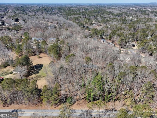 drone / aerial view with a view of trees