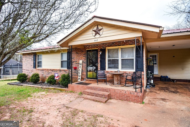 view of front of house featuring brick siding