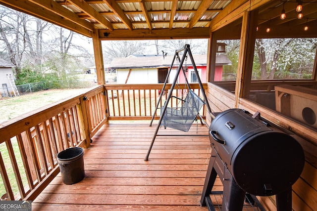 deck featuring fence and grilling area