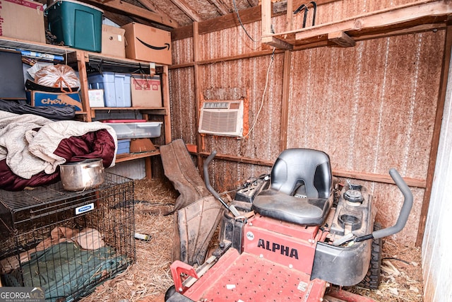 storage room featuring a wall mounted air conditioner