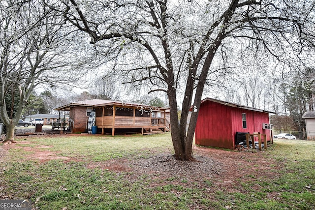 view of yard featuring a sunroom and an outdoor structure