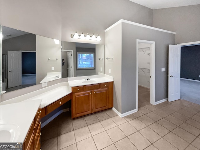 2708 Stockbridge Way, Dacula, GA 30019 - bathroom featuring tile patterned floors, two vanities, and a spacious closet