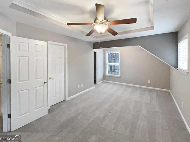 2708 Stockbridge Way, Dacula, GA 30019 - unfurnished bedroom with a tray ceiling, carpet floors, ornamental molding, and ceiling fan