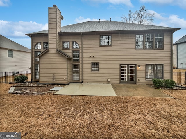 2708 Stockbridge Way, Dacula, GA 30019 - rear view of house with a patio, a chimney, and roof with shingles
