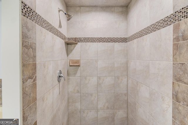 details featuring tiled shower