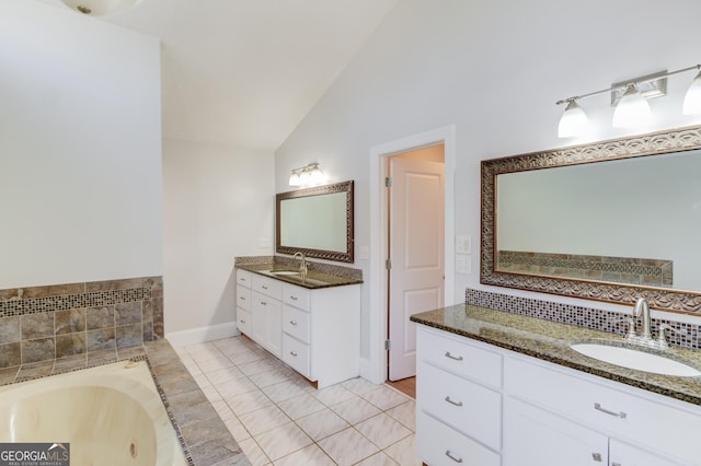 full bathroom featuring vaulted ceiling, tiled bath, two vanities, and a sink