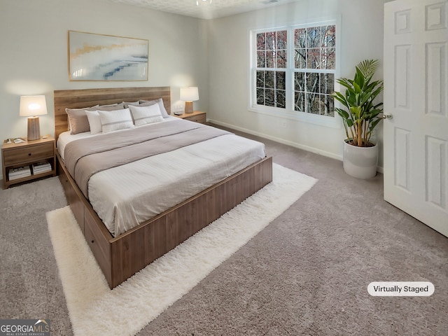bedroom with carpet floors and baseboards
