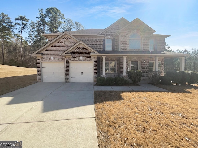 view of front facade featuring a porch, an attached garage, brick siding, concrete driveway, and a front yard