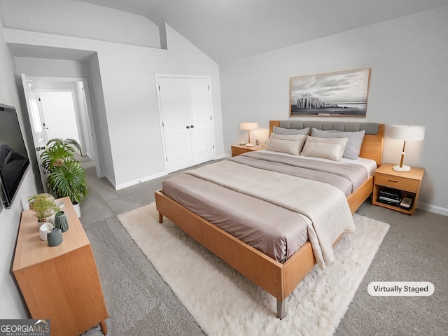 carpeted bedroom with baseboards, vaulted ceiling, and a closet