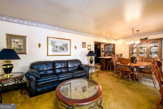 carpeted living area featuring a notable chandelier