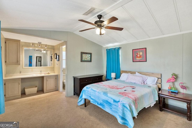 bedroom with vaulted ceiling, light carpet, visible vents, and ensuite bathroom