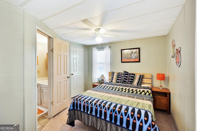 bedroom featuring a ceiling fan, a closet, and light colored carpet