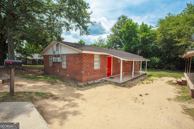 exterior space featuring brick siding