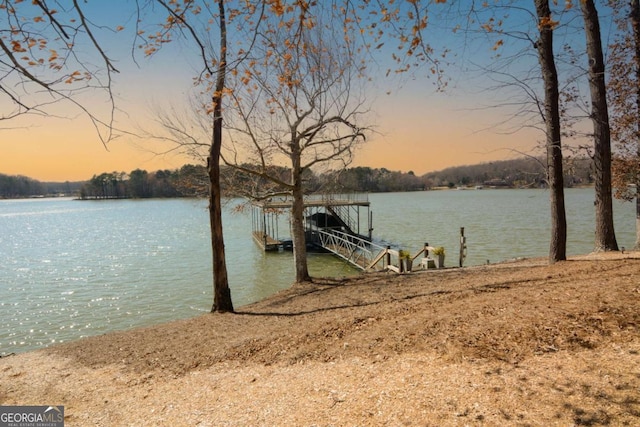 view of dock featuring a water view and boat lift