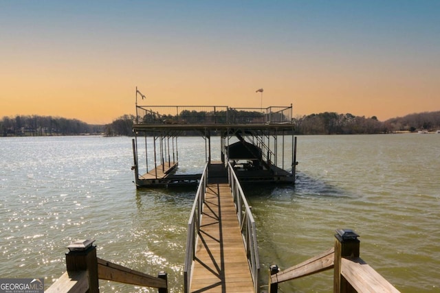 view of dock featuring a water view and boat lift