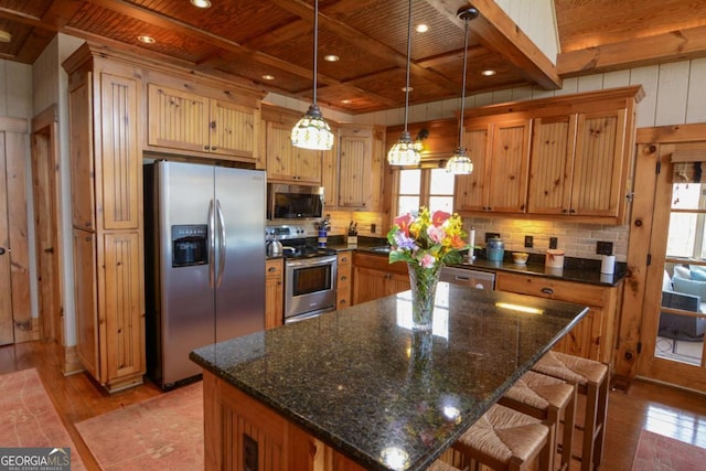 kitchen with stainless steel appliances, wooden ceiling, a wealth of natural light, and light wood-style floors