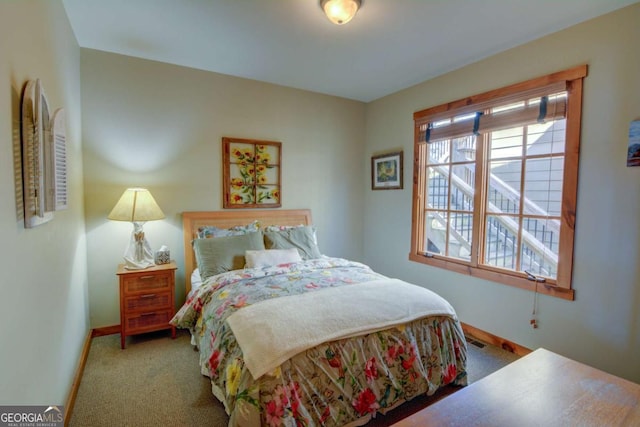 bedroom featuring carpet, visible vents, and baseboards