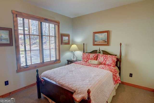 bedroom with carpet flooring and baseboards