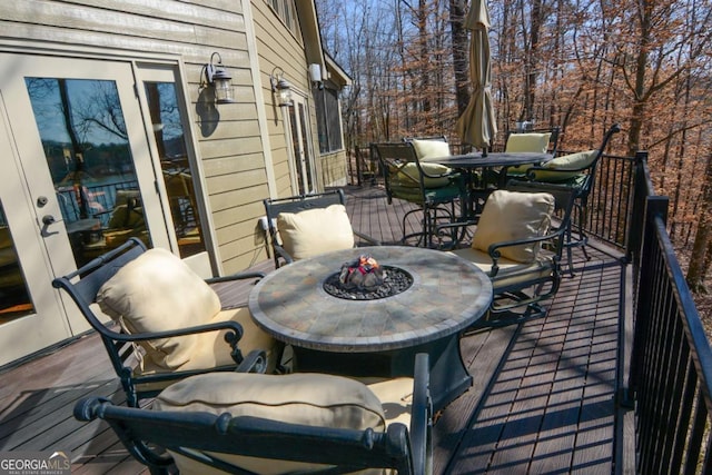 wooden deck featuring outdoor dining space