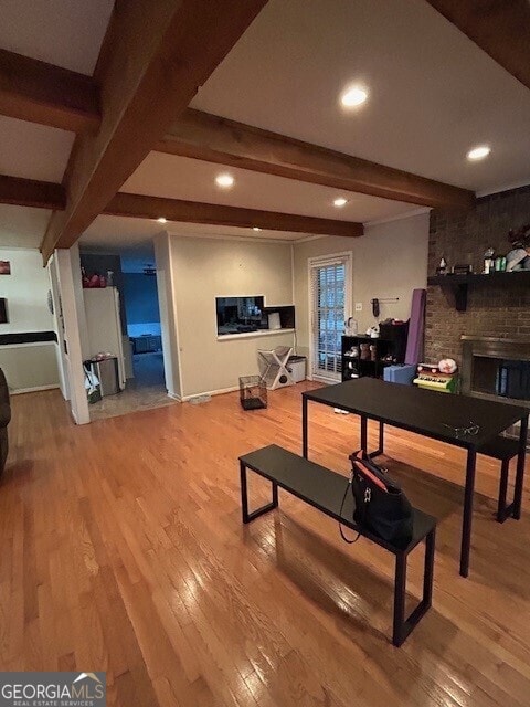 game room with recessed lighting, wood-type flooring, and beam ceiling